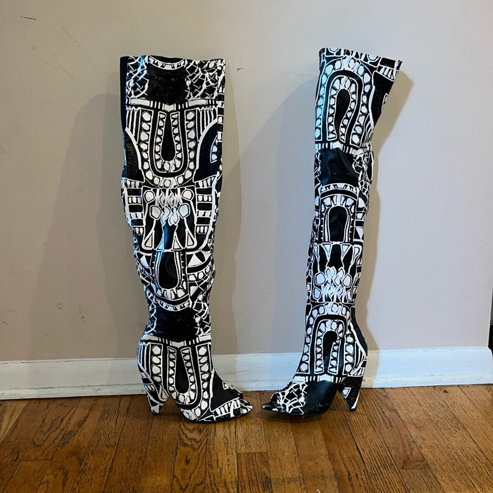 Black and white high thigh boots with low heel